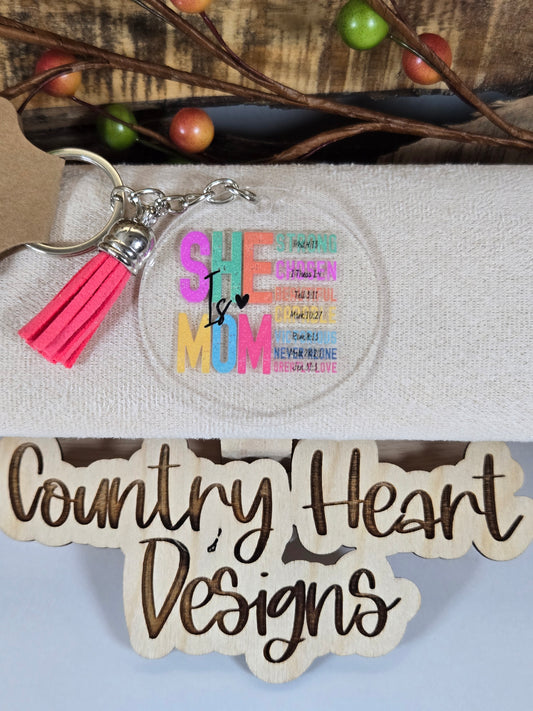 #867 She is Mom Keychain **𝑶𝒏𝒍𝒚 1 𝒊𝒏 𝑺𝒕𝒐𝒄𝒌**