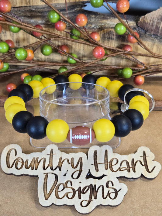 #927 New Orleans Saints Inspired Wristlet 🏈😉  **1 𝑎𝑣𝑎𝑖𝑙𝑎𝑏𝑙𝑒 𝑚𝑎𝑑𝑒 𝑏𝑢𝑡 𝑡ℎ𝑖𝑠 𝑖𝑡𝑒𝑚 𝑤𝑖𝑙𝑙 𝑏𝑒 𝑟𝑒𝑠𝑡𝑜𝑐𝑘𝑒𝑑/𝑚𝑎𝑑𝑒 𝑎𝑠 𝑖𝑡 𝑠𝑒𝑙𝑙𝑠 𝑜𝑢𝑡!!