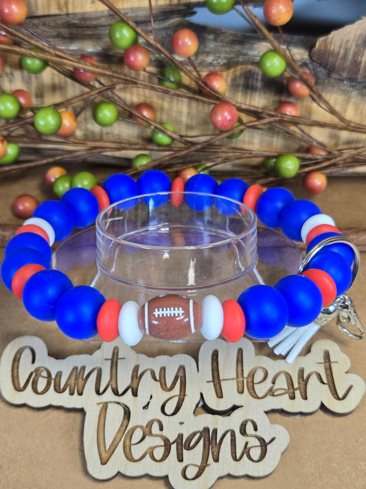 #958 New York Giants Inspired Wristlet 🏈😉  **1 𝑎𝑣𝑎𝑖𝑙𝑎𝑏𝑙𝑒 𝑚𝑎𝑑𝑒 𝑏𝑢𝑡 𝑡ℎ𝑖𝑠 𝑖𝑡𝑒𝑚 𝑤𝑖𝑙𝑙 𝑏𝑒 𝑟𝑒𝑠𝑡𝑜𝑐𝑘𝑒𝑑/𝑚𝑎𝑑𝑒 𝑎𝑠 𝑖𝑡 𝑠𝑒𝑙𝑙𝑠 𝑜𝑢𝑡!!